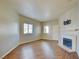 Bright living room showcasing hardwood floors, a cozy fireplace, and natural light at 5250 S Rainbow Blvd # 2120, Las Vegas, NV 89118