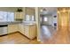 Open living space features hardwood floors, a fireplace and a bright kitchen at 5250 S Rainbow Blvd # 2120, Las Vegas, NV 89118