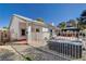 Backyard view showing home exterior, jacuzzi, and outdoor living space at 5301 Singing Hills Dr, Las Vegas, NV 89130