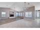 Open-concept living space with fireplace, tile flooring, and seamless flow to the kitchen at 5301 Singing Hills Dr, Las Vegas, NV 89130