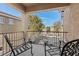 Outdoor balcony featuring seating, offering a relaxing space with views of the surrounding neighborhood at 7017 Pink Flamingos Pl, North Las Vegas, NV 89084