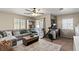 Comfortable bedroom featuring natural light, neutral tones, and a ceiling fan for added relaxation at 7017 Pink Flamingos Pl, North Las Vegas, NV 89084