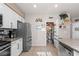 Functional kitchen with stainless steel appliances, lots of storage and a convenient pantry at 7017 Pink Flamingos Pl, North Las Vegas, NV 89084