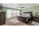 Calm main bedroom retreat filled with bright natural light, a ceiling fan, and stylish decor at 7017 Pink Flamingos Pl, North Las Vegas, NV 89084