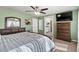 Inviting main bedroom offering ample natural light, complemented by a spacious dresser and a private bathroom entrance at 7017 Pink Flamingos Pl, North Las Vegas, NV 89084