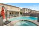 Backyard pool and spa with patio area, perfect for outdoor entertaining and relaxation at 7017 Pink Flamingos Pl, North Las Vegas, NV 89084