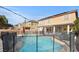 Backyard with a refreshing swimming pool, spa, and surrounding patio area at 7017 Pink Flamingos Pl, North Las Vegas, NV 89084