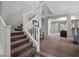 Carpeted stairs with white railings lead to the upper level, offering a glimpse of other rooms in the home at 7171 Willow Moss Ct, Las Vegas, NV 89148