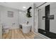 Bright bathroom featuring soaking tub, walk-in shower with black tile accents, and wood-look flooring at 7285 Pinebrook Cir, Las Vegas, NV 89147