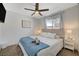 Cozy bedroom featuring plush carpet, ceiling fan, neutral color palette, and a comfortable bed at 7285 Pinebrook Cir, Las Vegas, NV 89147