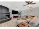 Inviting living room features a brick fireplace, large TV, and comfortable seating at 7285 Pinebrook Cir, Las Vegas, NV 89147