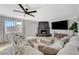 Inviting living room features a brick fireplace, large TV, and comfortable seating at 7285 Pinebrook Cir, Las Vegas, NV 89147