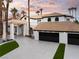 Elegant two-story home featuring a three-car garage, private entry, and well-manicured landscaping at 74 Innisbrook Ave, Las Vegas, NV 89113