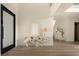 Bright and airy foyer with modern decor and wood flooring at 74 Innisbrook Ave, Las Vegas, NV 89113