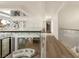 Hallway featuring wood floors and glass railings overlooking the entry at 74 Innisbrook Ave, Las Vegas, NV 89113