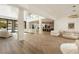 Spacious open-concept living area with herringbone floors and modern furnishings at 74 Innisbrook Ave, Las Vegas, NV 89113
