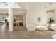 Open-concept living area with stylish furnishings and herringbone wood floors at 74 Innisbrook Ave, Las Vegas, NV 89113