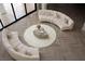 Overhead view of a stylish living room with curved sofas and modern accents at 74 Innisbrook Ave, Las Vegas, NV 89113