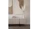 Neutral living room featuring modern art, light fixture and beige furniture at 74 Innisbrook Ave, Las Vegas, NV 89113