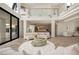 Bright and spacious living area with contemporary decor and glass railing at 74 Innisbrook Ave, Las Vegas, NV 89113