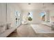 Bright main bedroom features herringbone floors, arched windows, and ample seating at 74 Innisbrook Ave, Las Vegas, NV 89113