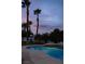 Backyard swimming pool with a jacuzzi, and decorative tile under a twilight sky at 74 Innisbrook Ave, Las Vegas, NV 89113