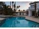 Stunning backyard featuring a sparkling pool and a pool house, perfect for entertaining at 74 Innisbrook Ave, Las Vegas, NV 89113
