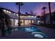 Inviting backyard with a pool and hot tub, perfect for relaxation and entertaining with a stunning home backdrop at 74 Innisbrook Ave, Las Vegas, NV 89113