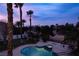 Aerial view of a sparkling pool and hot tub, set amidst lush greenery in a serene outdoor space at 74 Innisbrook Ave, Las Vegas, NV 89113