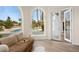 Sitting area offering views of the pool area through arched windows and glass doors at 74 Innisbrook Ave, Las Vegas, NV 89113