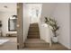 View of staircase with light wood stairs and decorative elements and leading to an office at 74 Innisbrook Ave, Las Vegas, NV 89113