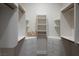 Spacious walk-in closet featuring custom shelving, drawers, and ample storage space at 74 Innisbrook Ave, Las Vegas, NV 89113