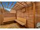 Backyard patio featuring wood trellis and built-in bench at 7873 Marbledoe St, Las Vegas, NV 89149