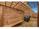 Backyard patio featuring trellis, brick wall, and barbecue at 7873 Marbledoe St, Las Vegas, NV 89149