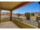 A covered balcony area with views of surrounding homes and clear blue skies at 7873 Marbledoe St, Las Vegas, NV 89149