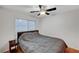 This bedroom has wood floors and a ceiling fan at 7873 Marbledoe St, Las Vegas, NV 89149