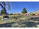 Well-maintained community park featuring lush green space, mature trees, walking paths, and comfortable benches at 7873 Marbledoe St, Las Vegas, NV 89149