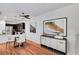 Charming dining area with hardwood floors, modern furniture, and stainless steel appliances in the adjacent kitchen at 7873 Marbledoe St, Las Vegas, NV 89149