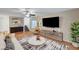 Inviting living room with hardwood floors, stylish decor, and a modern entertainment center at 7873 Marbledoe St, Las Vegas, NV 89149