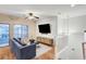 Comfortable living space with hardwood floors and access to an outdoor balcony at 7873 Marbledoe St, Las Vegas, NV 89149
