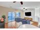 Bright living area with sliding glass doors leading to a balcony, and modern furnishings at 7873 Marbledoe St, Las Vegas, NV 89149