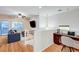 Cozy loft area with hardwood floors, a comfortable sofa, and a dedicated workspace at 7873 Marbledoe St, Las Vegas, NV 89149