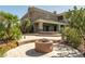 Backyard showcasing an outdoor firepit, patio space, and desert landscaping, perfect for entertaining at 861 Majestic Ridge Ct, Henderson, NV 89052