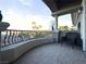 Balcony with stone pavers and curved wrought iron railing featuring views of palm trees at 861 Majestic Ridge Ct, Henderson, NV 89052