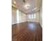 Large bedroom with hardwood floors and bright windows with modern white shutters at 861 Majestic Ridge Ct, Henderson, NV 89052