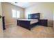 Bedroom suite with a plush bed, window with shutters, and carpet flooring at 861 Majestic Ridge Ct, Henderson, NV 89052