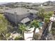 Stunning aerial view of home featuring a backyard pool and a tile roof in a desert landscape at 861 Majestic Ridge Ct, Henderson, NV 89052