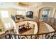 Open-concept home with a stunning wrought iron staircase, dining area, and upstairs living space at 861 Majestic Ridge Ct, Henderson, NV 89052