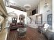 Expansive living room with soaring ceilings, fireplace, and hardwood floors at 861 Majestic Ridge Ct, Henderson, NV 89052