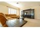 Comfortable upstairs living room with cozy leather seating and a large entertainment center at 861 Majestic Ridge Ct, Henderson, NV 89052
